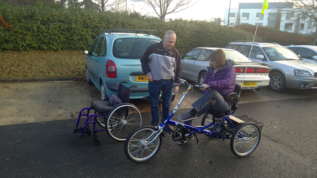 Judy on her trike, finally out of her wheelchair Judy on her trike, finally out of her wheelchair